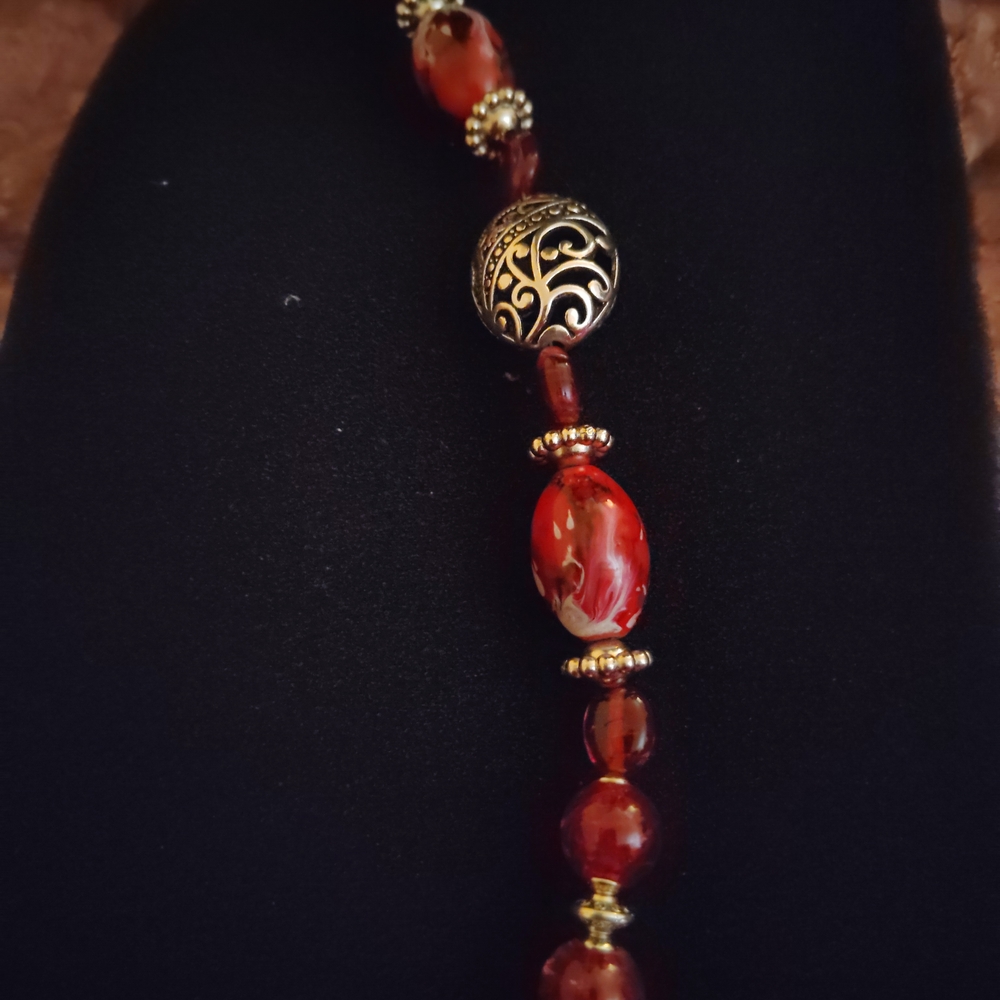 Elegant Red Beaded Bracelet with Intricate Silver Accents - Picture 2 of 3